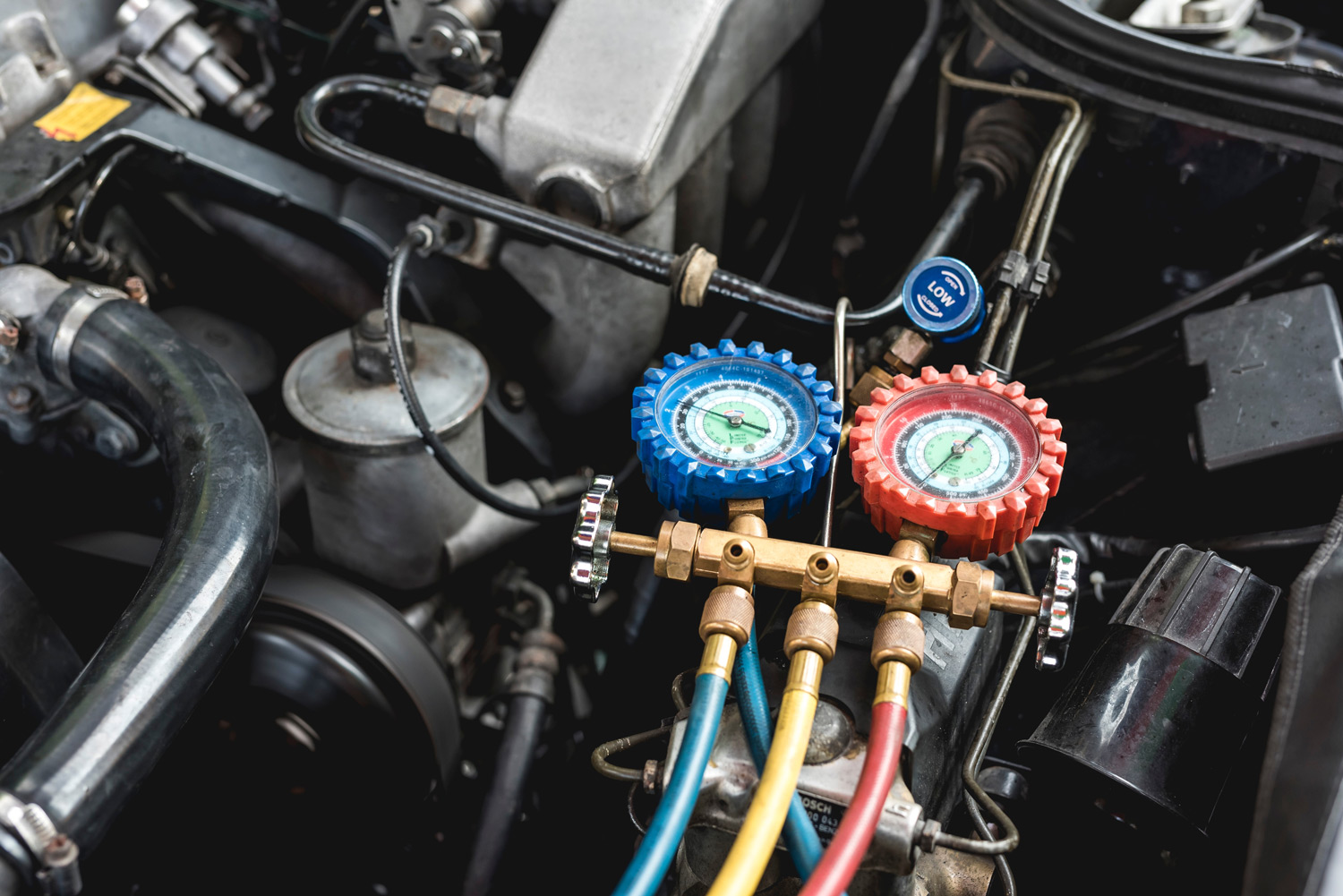 Pressure gauges for gases being transfered into a car AC unit as part of regasing service